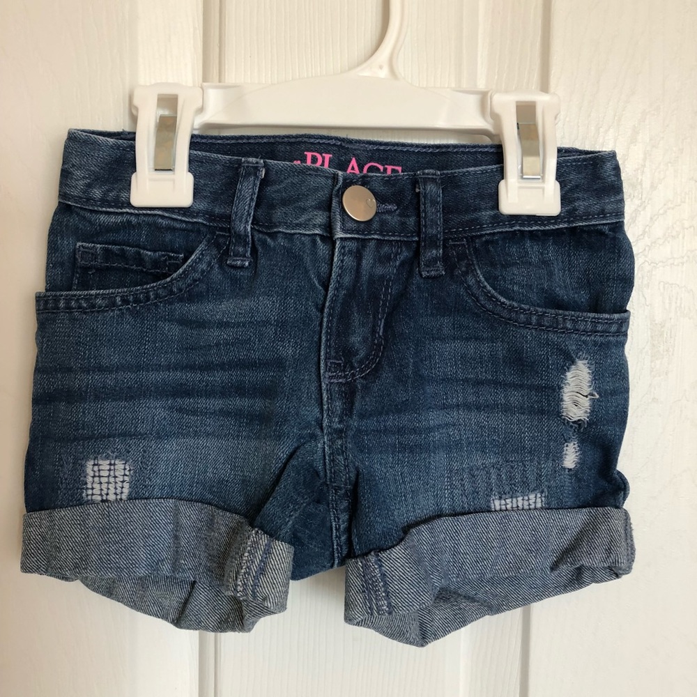 Dark blue ripped jean shorts